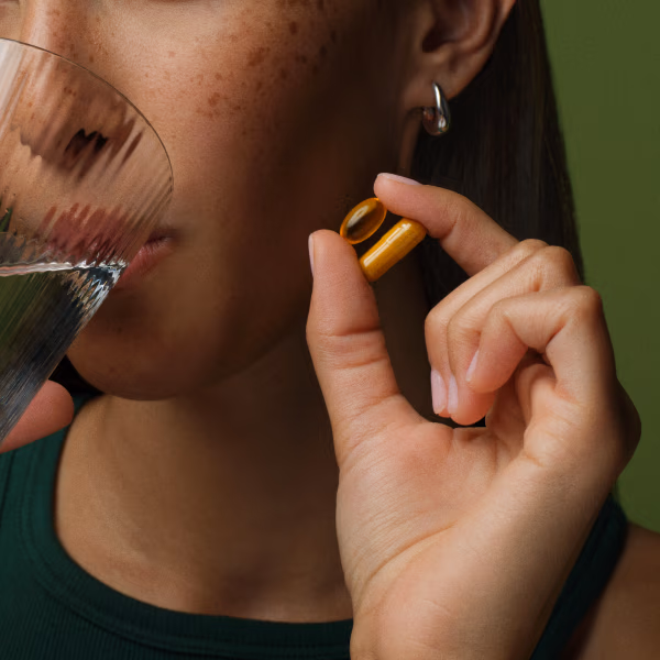Girl showing Custom Root Source® Hair Supplement