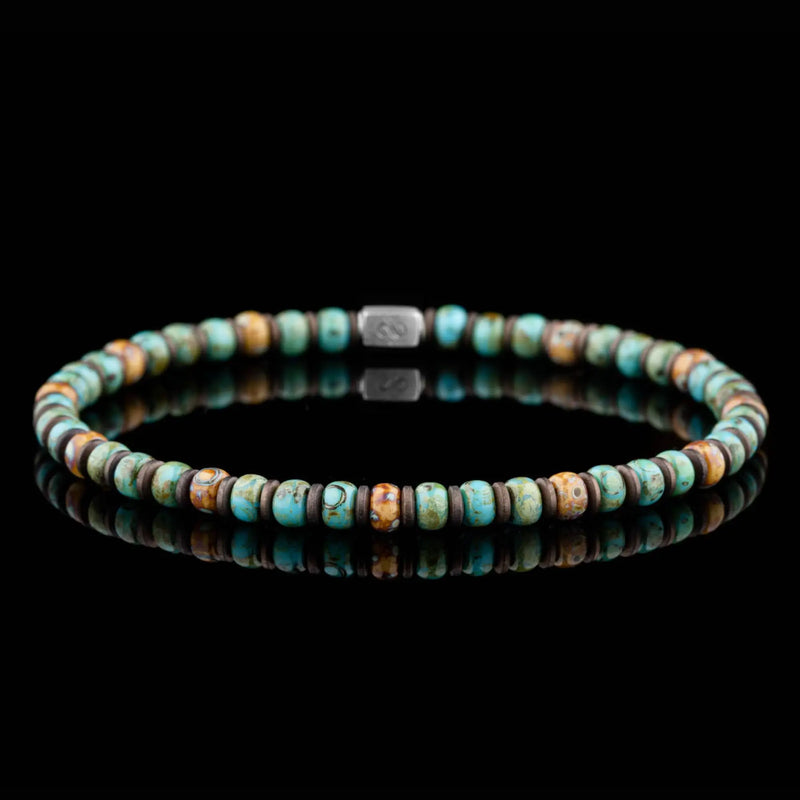 A mix of blue, cream and bronze-colored beads.