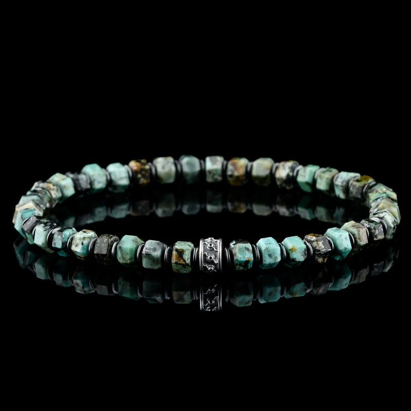 Green beads with mottled black and brown patterns.