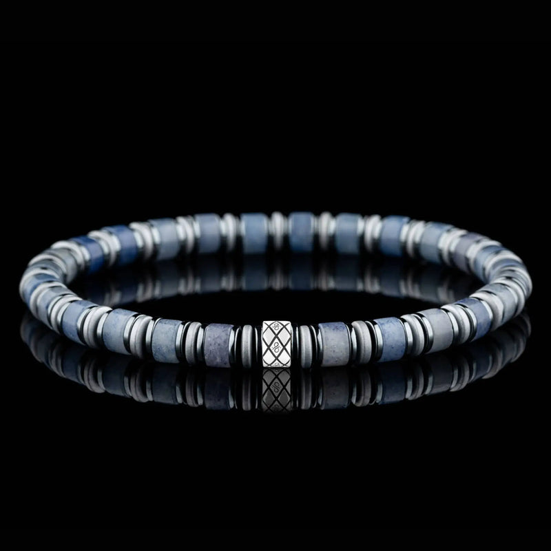 Blue and grey beads with dark spacers and a silver accent.