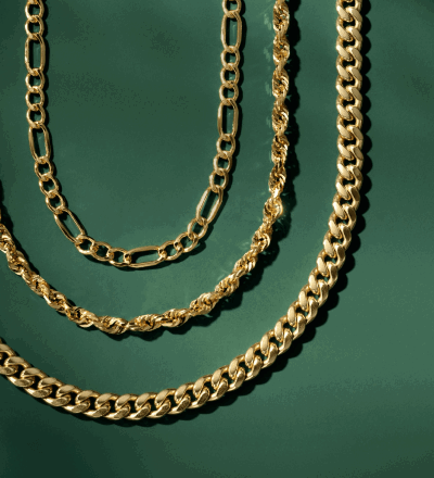 Three different gold men’s chain necklaces.