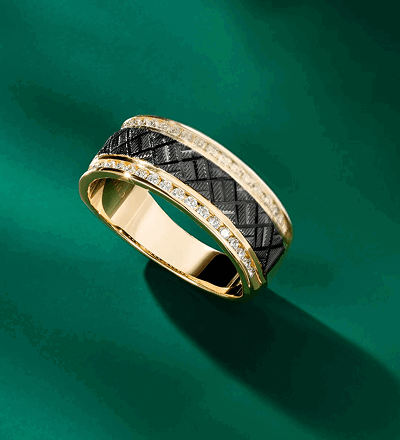 A yellow gold and black diamond men’s statement ring. 