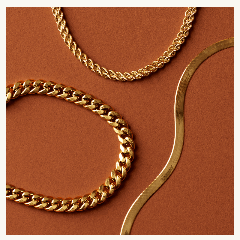 Twisted gold rope chain, thick gold curb link chain & smooth, gold flat herringbone chain.