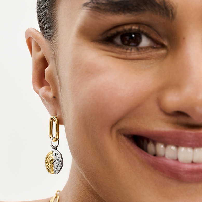 A model styles Pandora Talisman jewelry.