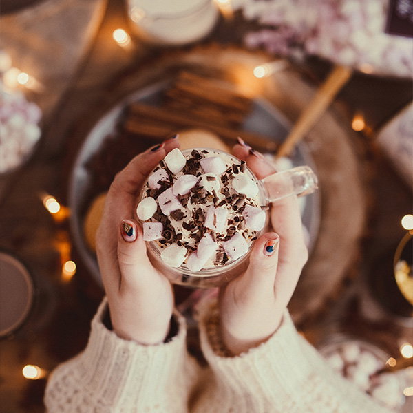 Image of hot chocolate being held by model