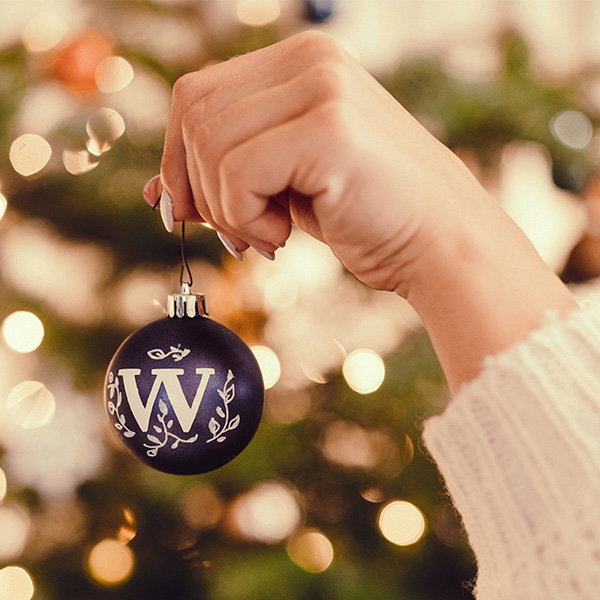 Image of a whittard bauble being held by model 