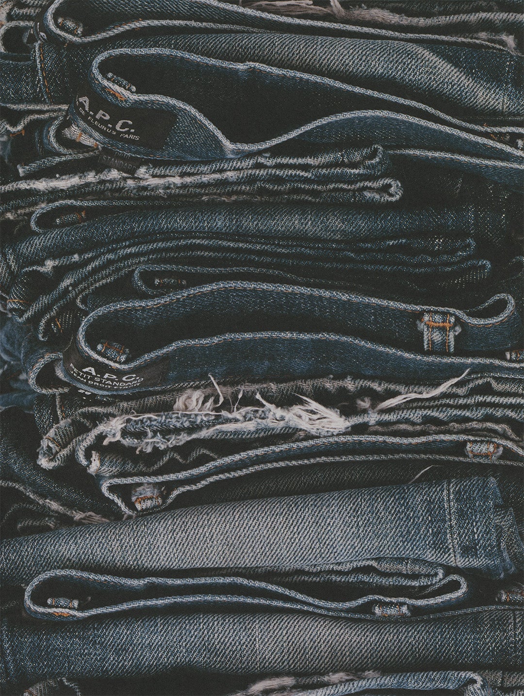 A.P.C. jeans in a folded stack