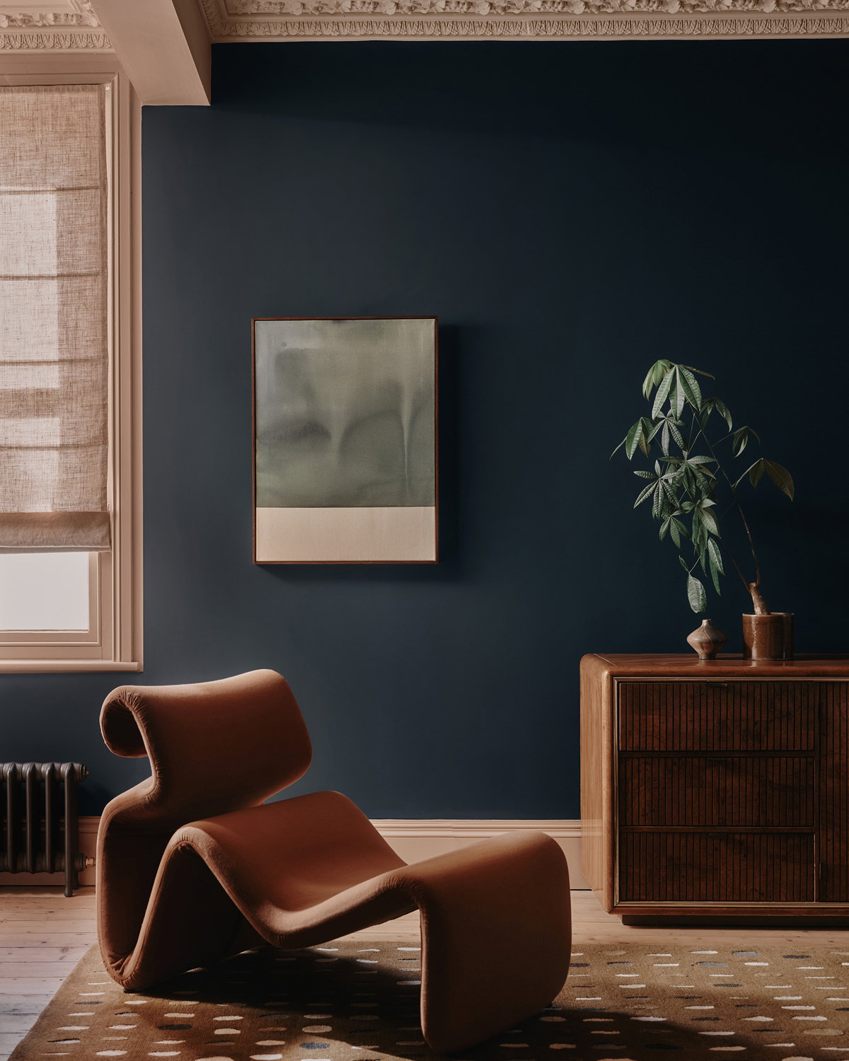Contemporary living room featuring Hague Blue cabinetry, Setting Plaster walls and modern furniture in a sophisticated colour palette.
