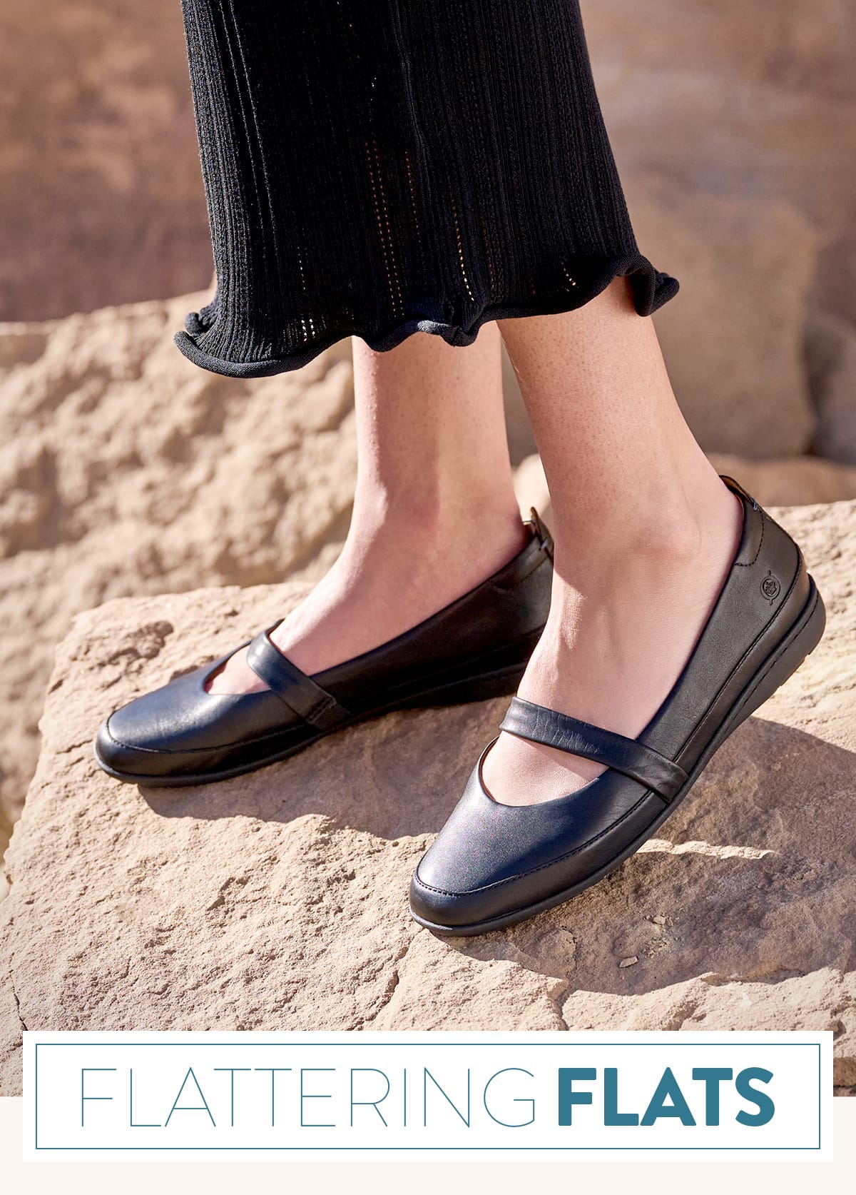 Flattering Flats. A woman standing on a rock wearing the Fianna mary jane flats in black.