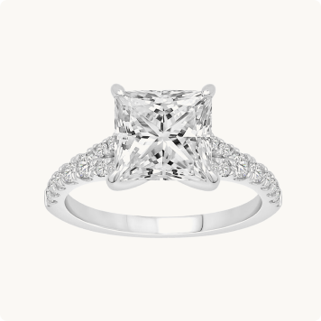 Princess-Cut Lab Grown 3ct. Diamond Split Shank Engagement Ring in 14k White Gold: White gold engagement ring with a princess-cut diamond in a four-prong setting and pavé diamonds lining both sides of the band.