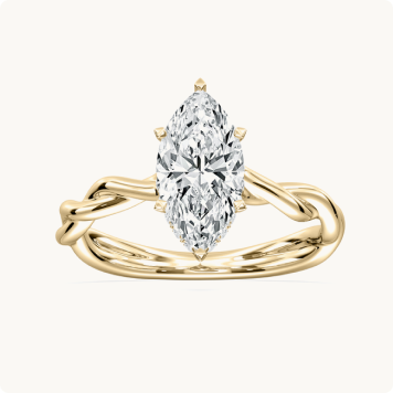 Marquise Lab Grown Diamond 2 1/8ctw. Twist Hidden Halo Engagement Ring in 14k Yellow Gold: Yellow gold engagement ring with a marquise-cut diamond in a six-prong setting on a twisted rope-style band.