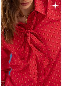 close up of red button up shirt with tie