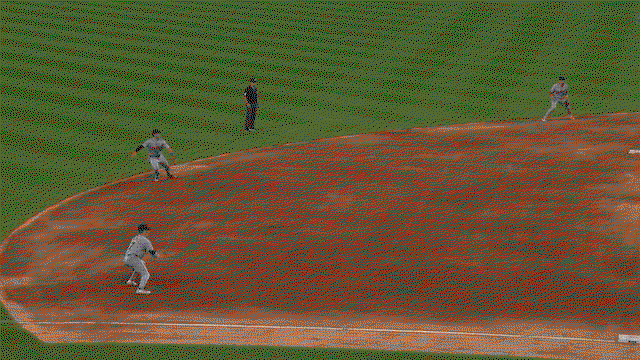 An animated GIF of Kevin McGonigle making a diving stop and throw to first