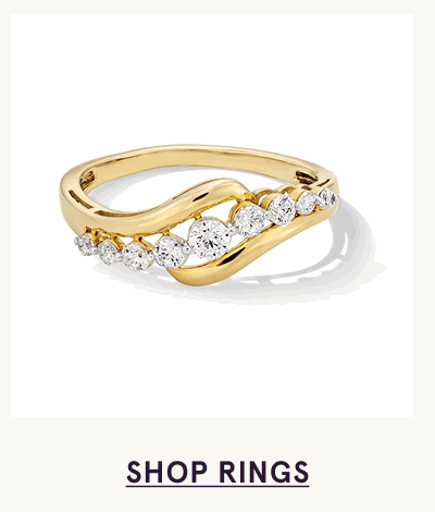 Wavy gold band accented with graduating row of round white diamonds nestled along the curve. Click here to shop rings