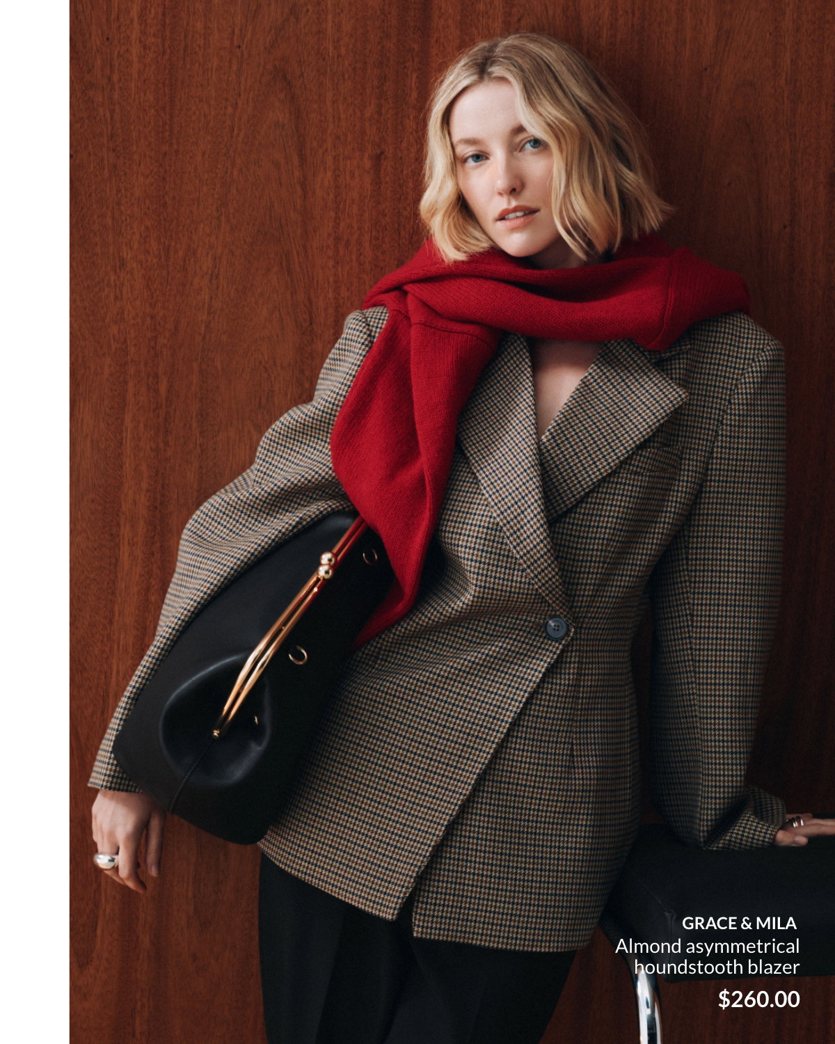 Woman wearing a Almond asymmetrical houndstooth blazer at 260 $