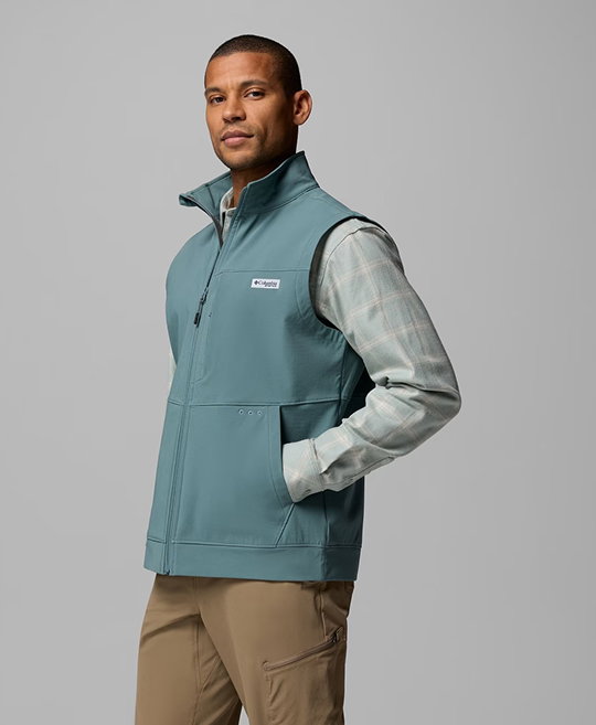 A man wearing a blue vest.