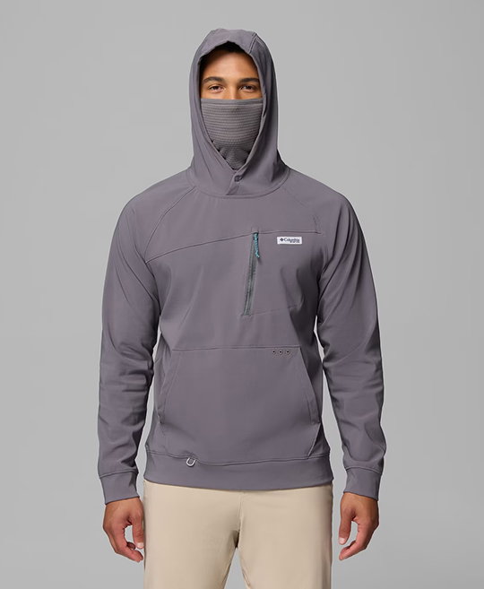 A man wearing a mauve hoodie with the hood up.