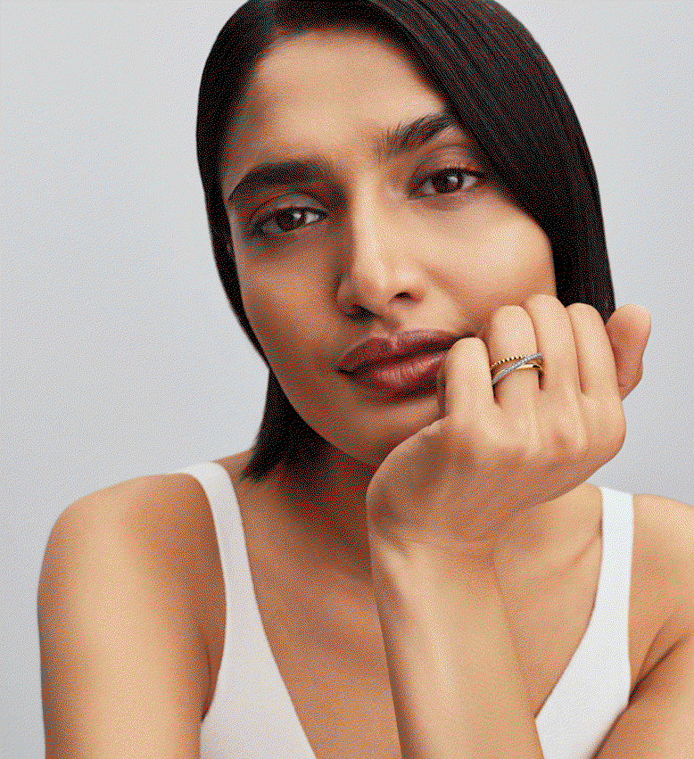 Model wears rings with contrasting metals