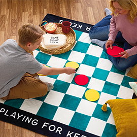 Giant checkers blanket and game.