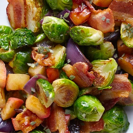 Brussels sprouts, apples, bacon, and onion tossed together.