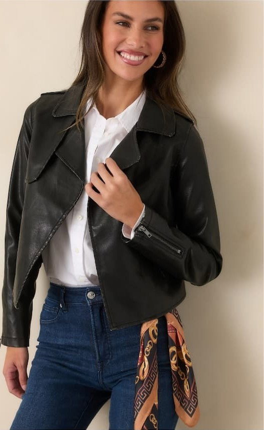 Woman wearing a Black Distressed Faux Leather Moto Jacket.
