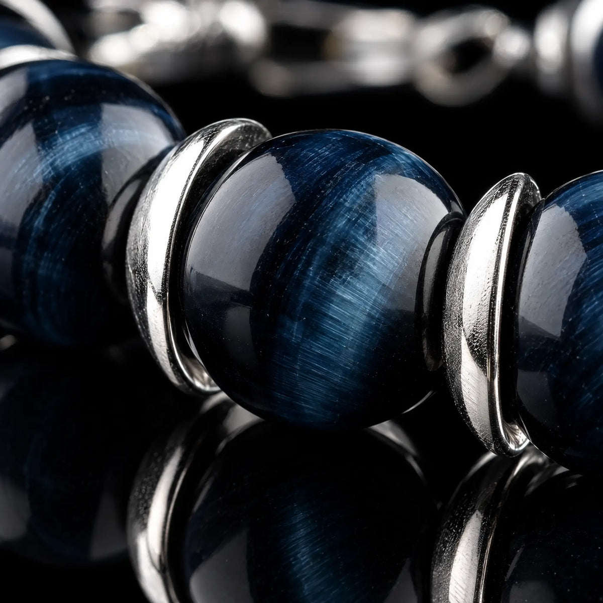 Close-up of Blue Tiger Eye Bracelet V (10mm), showing the blue stone banding and 925 sterling silver spacers.