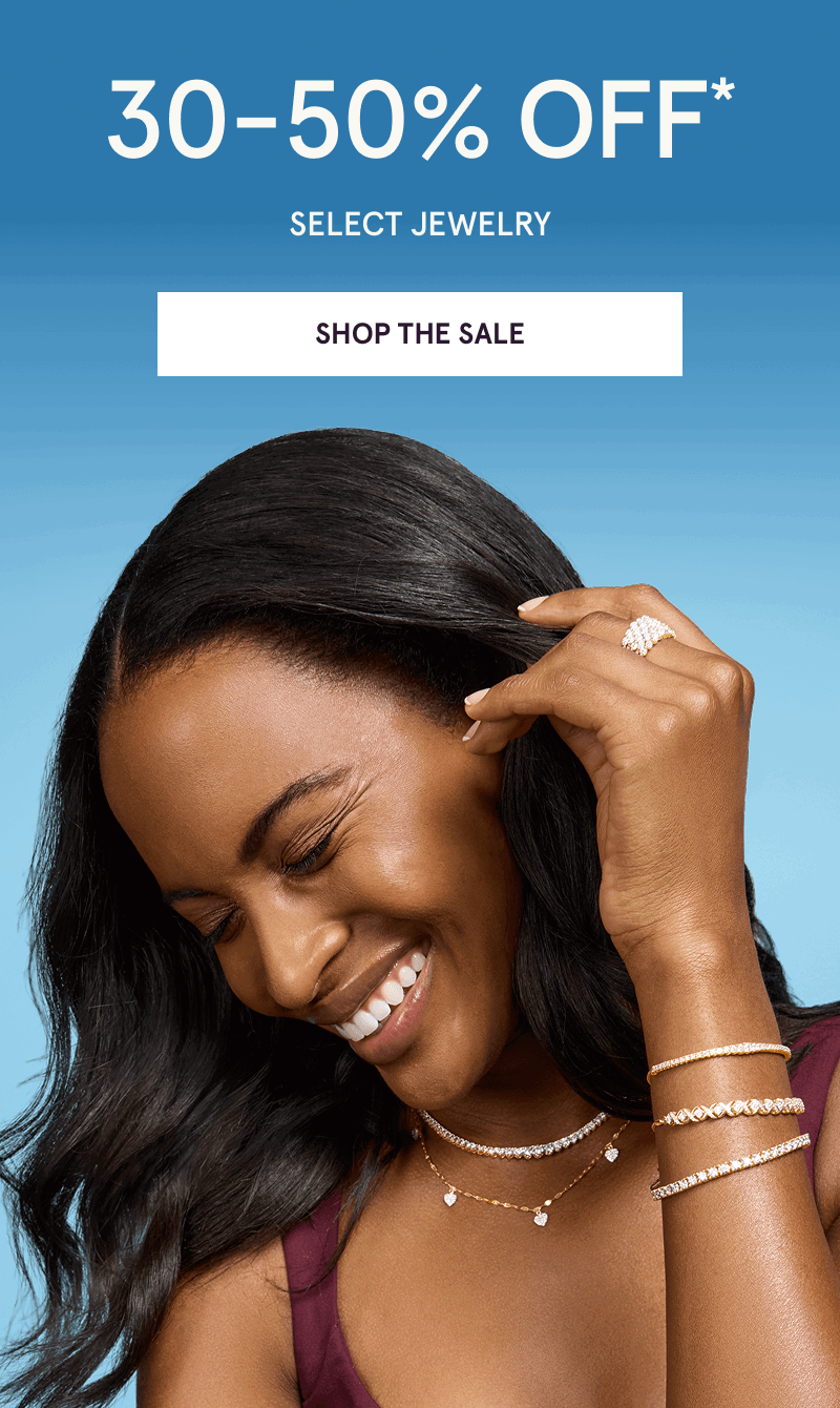Model in gold-set diamond bracelets, ring & layered necklaces. 30-50% OFF Select Jewelry. Click here to shop the sale