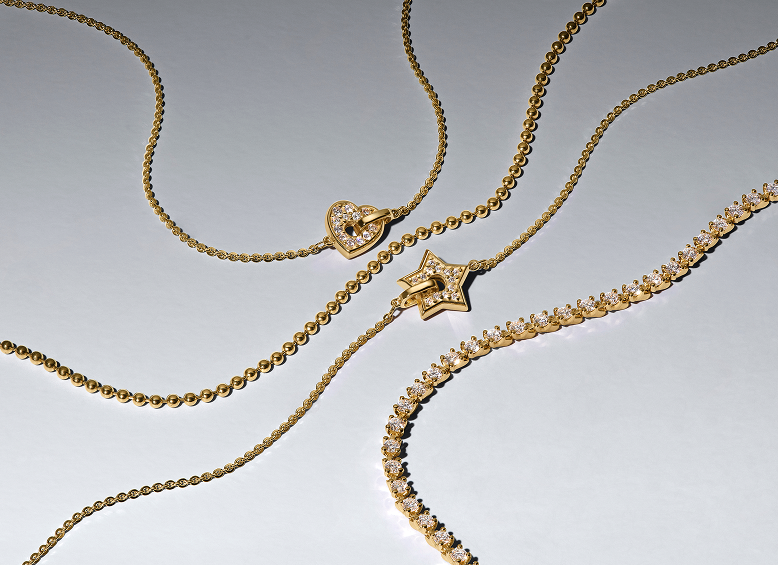 Close up of lab-grown diamond heart and star necklaces