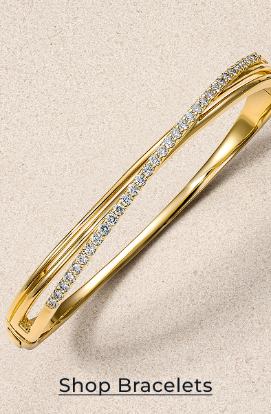 Yellow gold and diamond bangle bracelet. Click to Shop Bracelets