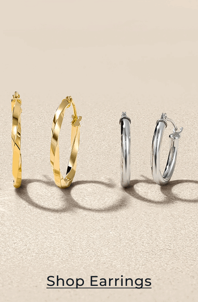 Two different pairs of delicate hoop earrings. Click to Shop Earrings