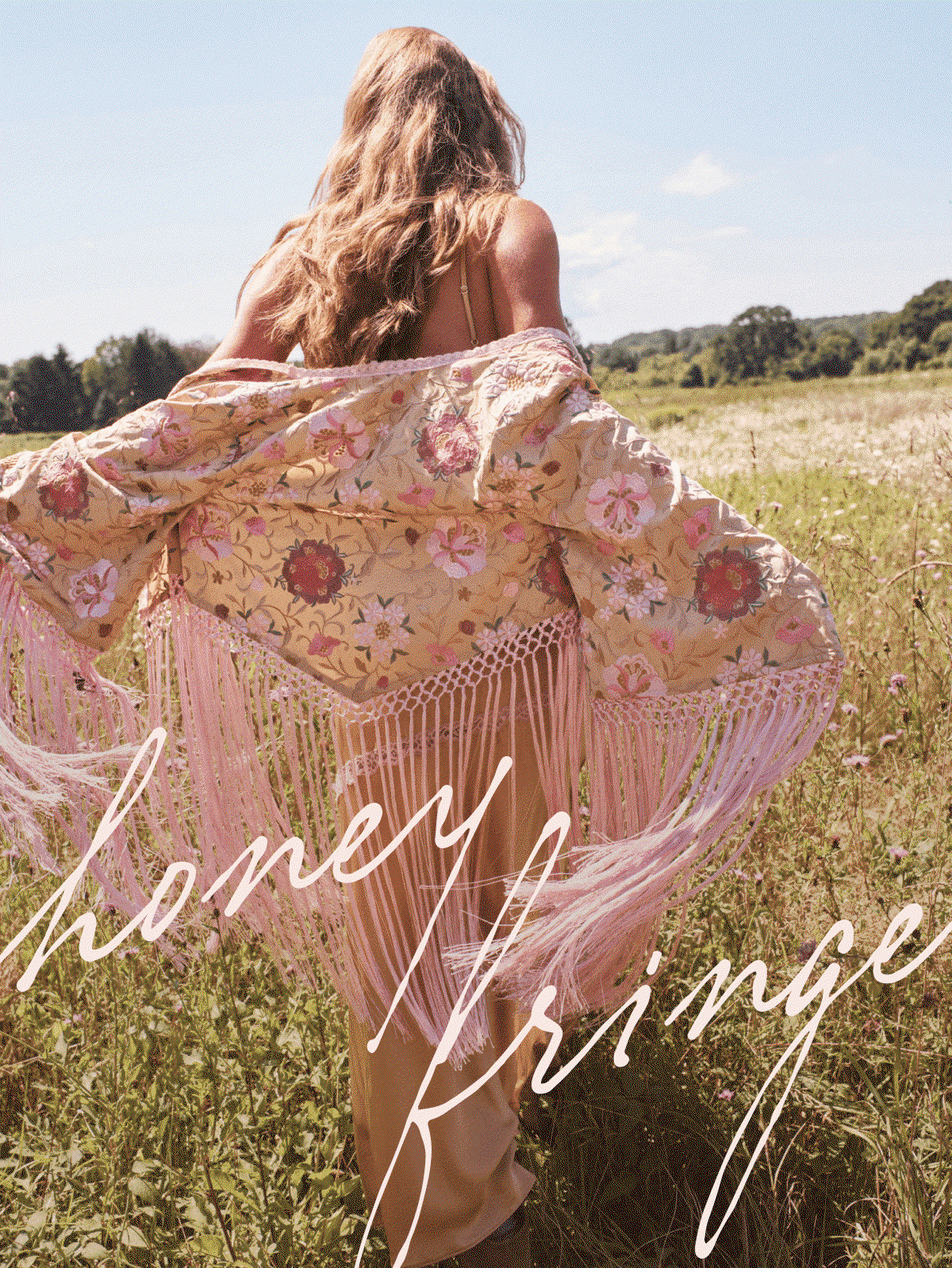 INTRODUCING  HONEY FRINGE A little gilded, a little undone. Inspired by Rococo romance, Honey Fringe unfolds in warm golden florals and intricate embroidery. An open kimono top with pink braided trim pairs with sweeping wide-leg pants, pieces that feel discovered, collected, and entirely of the moment.