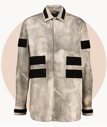 Grey button-up shirt with black stripe detailing on the sleeves and front, displayed against a beige circular background.