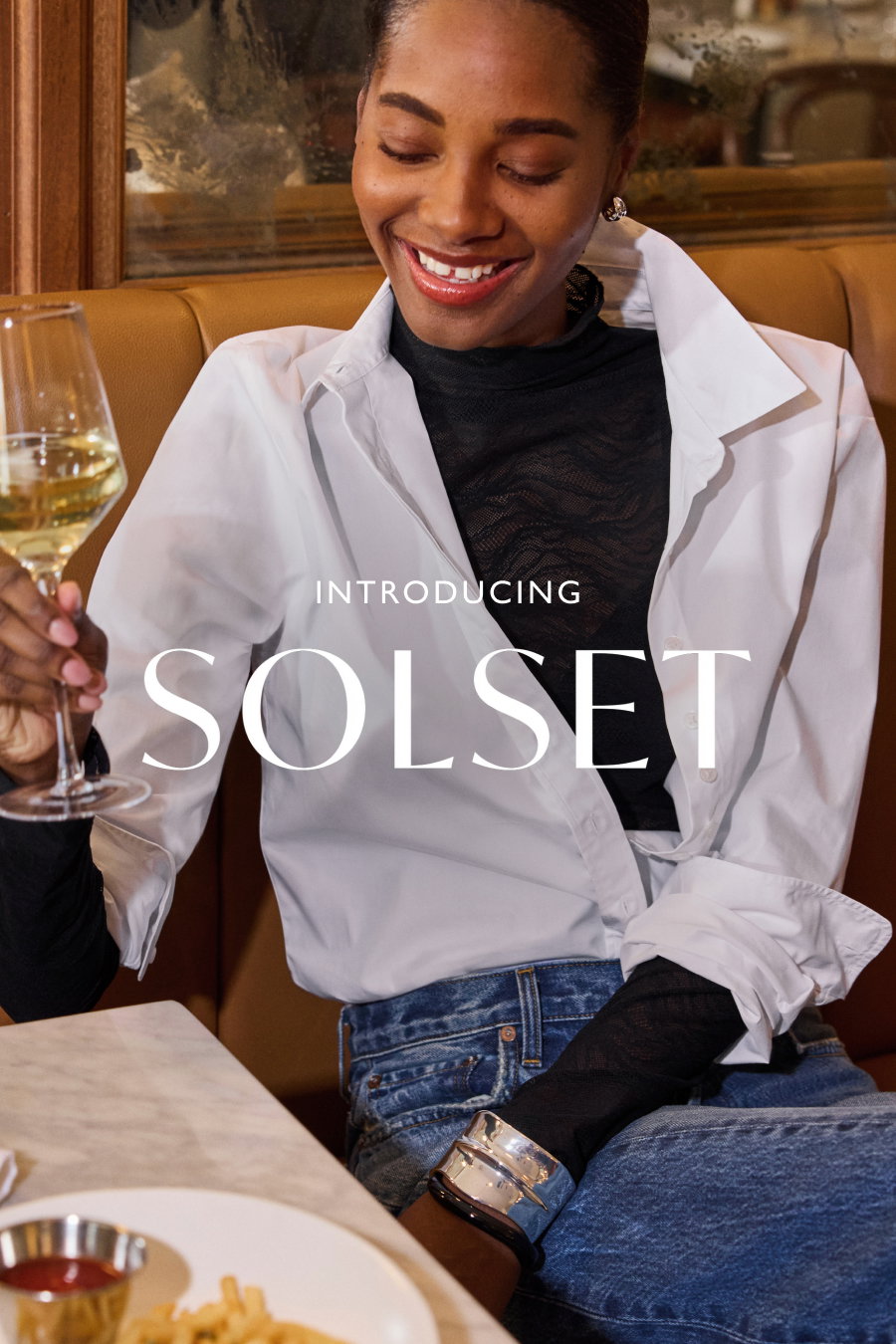 Introducing Solset. Image of woman toasting in new look from EVEREVE.