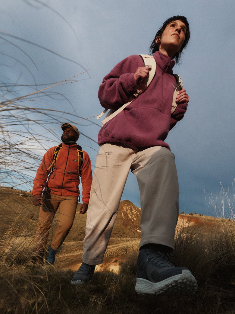 Man and woman hiking up a mountain