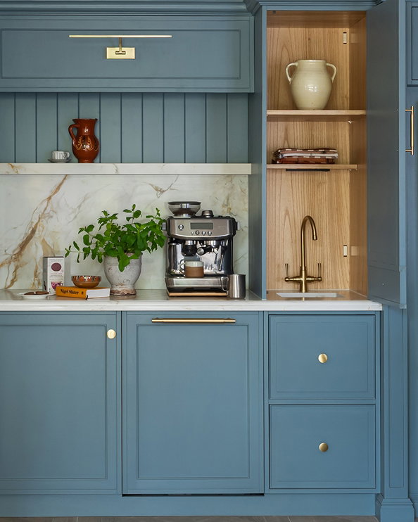 Bright kitchen featuring soft blue Selvedge cabinetry, paired with natural materials and light-filled interiors for a relaxed feel.