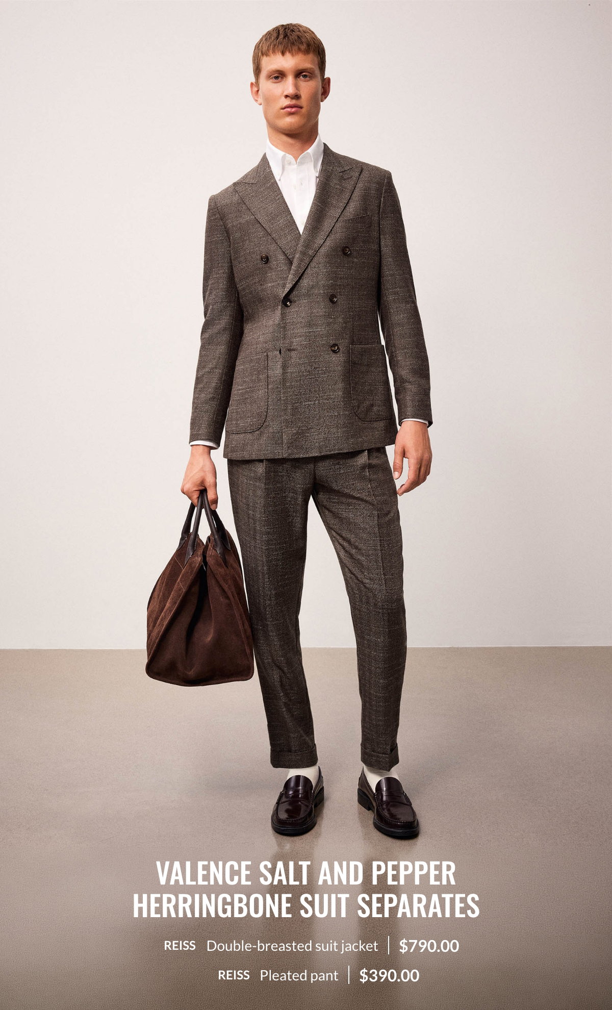Man wearing the Valence salt and pepper herringbone suit separates : double-breasted suit jacket at 790.00$ and pleated pant at 390.00$