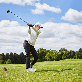 Woman teeing of at Portal Hotel, Golf & Spa