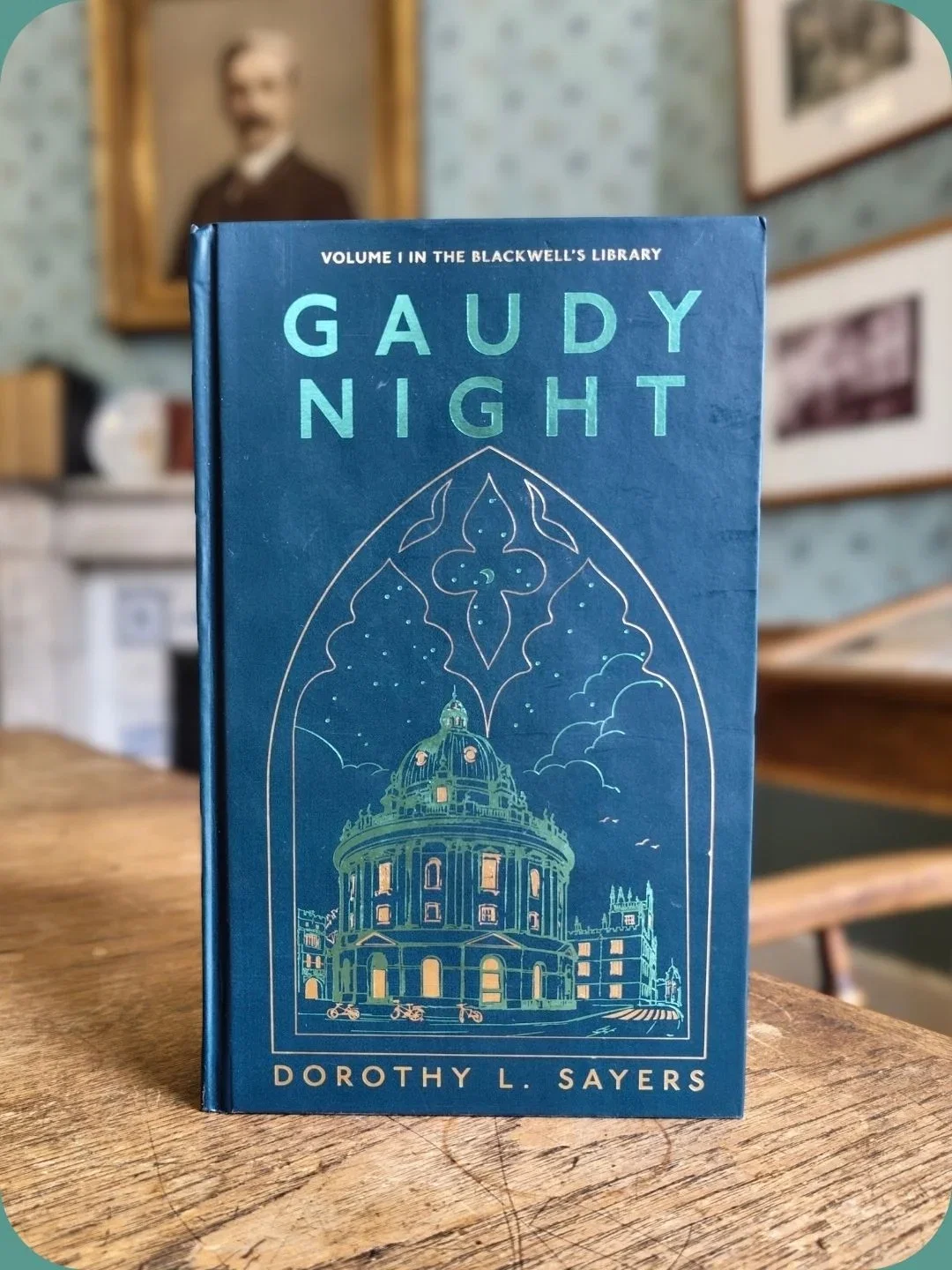 "Gaudy Night" book cover with architectural design.