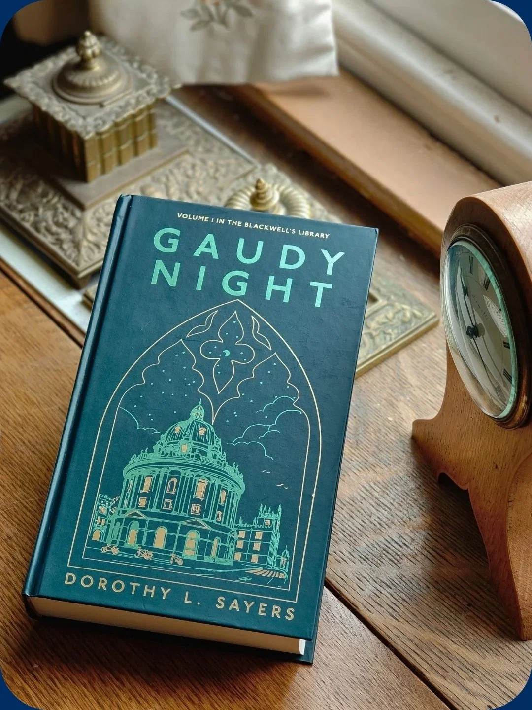 Book 'Gaudy Night' by Dorothy Sayers on table.