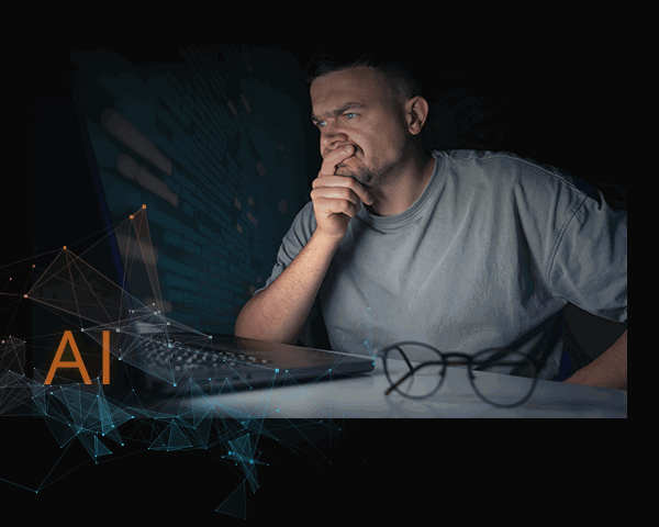 (image: Man looking at his computer)