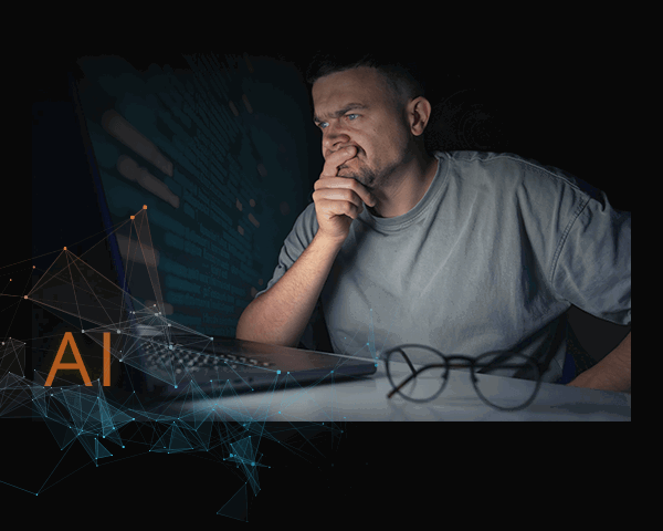 (image: Man looking at his computer)