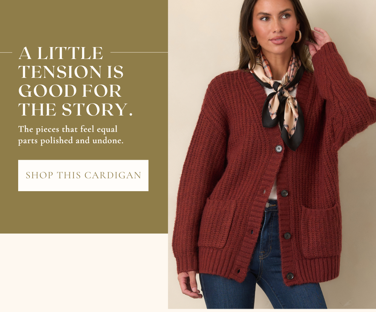 'A little tension is good for the story. Shop this cardigan.' Model wearing a red cardigan.