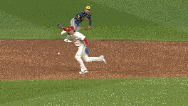 An animated gif of Brewers shortstop Joey Ortiz making a diving stop on the infield