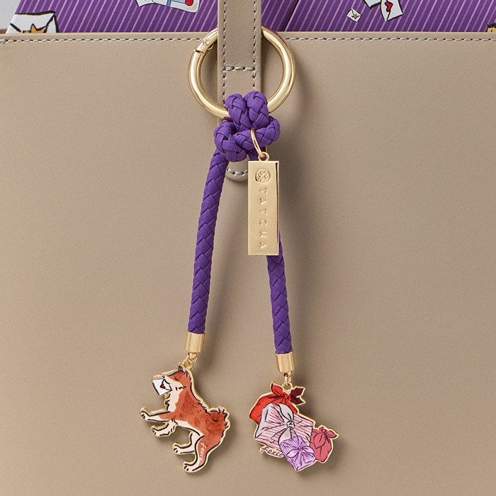 An image of a holiday themed bag charm included with all holiday set purchases