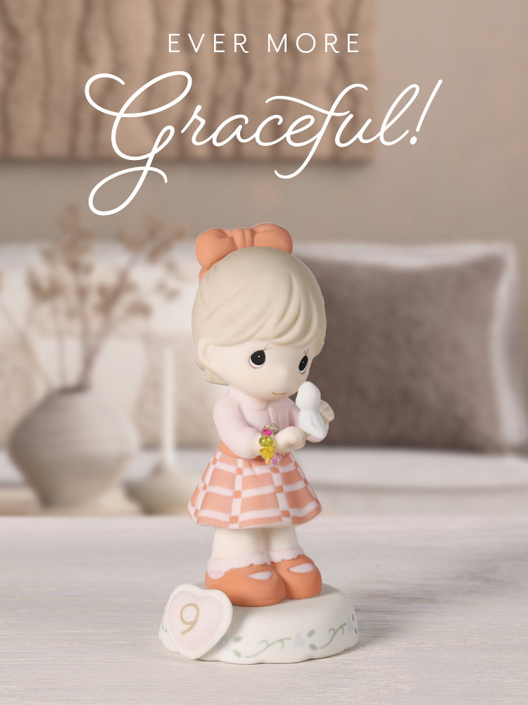 Growing In Grace age 9 girl figurine with bluebird and beaded bracelet